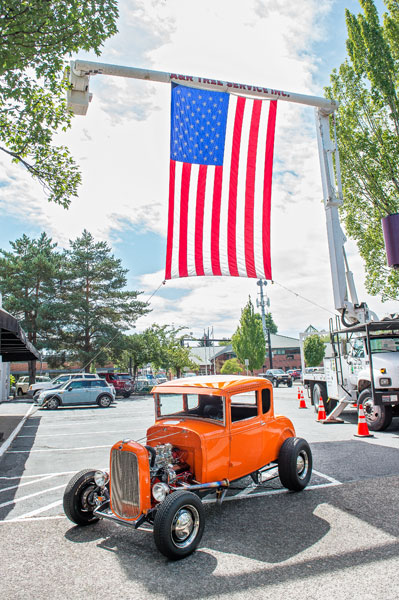 Rusty Rae/News-Register
##Giving the nation’s colors a salute, this cherry 1931 Model A Ford Coupe Hiboy with a 32 Mord Grille was a treat for Cruising McMinnville car show entrants.,