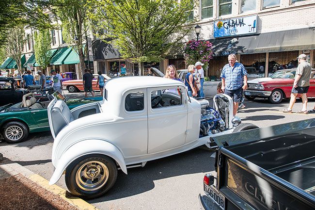 Rusty Rae/News-Register##
Royal Kenton’s 1932 white Ford 5-Window Coupe draws great interest during Saturday s car show. So did the car s story: It was a rusted hulk when it was pulled from a stream in Southern Oregon; now it s a beauty queen.