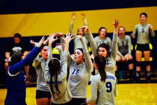 Rusty Rae/News-Register##
Amity players led by Madison Vrell (18) celebrate a point against the Spartans. Rusty Rae/News-Register##
Amity players led by Madison Vrell (18) celebrate a point against the Spartans.