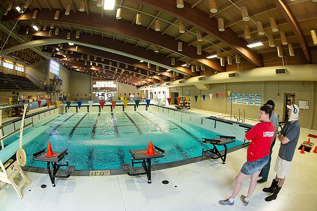 Rusty Rae / News-Register##
Workers begin pumping nearly 100,000 gallons of water into the competition pool at the McMinnville Aquatic Center, which is closed until Sept.9 for annual cleaning, maintenance and staff training.