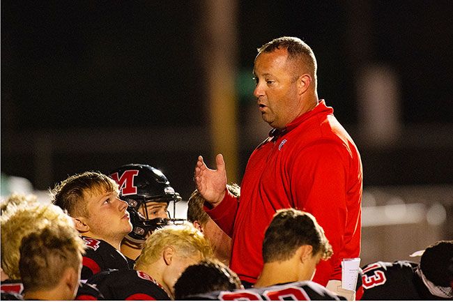 Rusty Rae/News-Register##
McMinnville head coach Ryan McIrvin address his team after the Grizzlies season opening win over Milwaukie, 41-7.