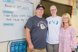 Rusty Rae/News-Register##Kasey Anderson, center, and her parents, Tom and Michelle Anderson, are all members of the Willamina School District faculty. Kasey, a 2016 Willamina graduate, is a first-year instructor, teaching sixth-grade math. Rusty Rae/News-Register##Kasey Anderson, center, and her parents, Tom and Michelle Anderson, are all members of the Willamina School District faculty. Kasey, a 2016 Willamina graduate, is a first-year instructor, teaching sixth-grade math.