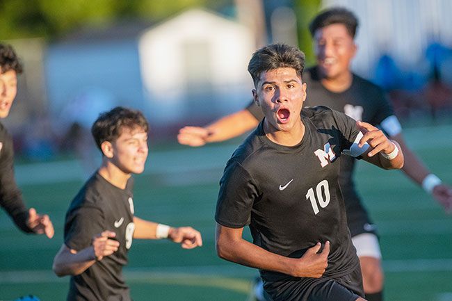 Rusty Rae/News-Register##Senior Rodolfo Figueroa celebrates with teammates after scoring a goal off a Jose Farias assist in the first half to tie the game 1-1 against Lincoln.