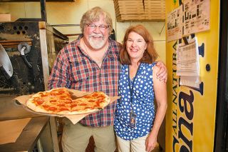 Rusty Rae/News-Register##
Al and Megan Whitaker and their crew serve up New York-style thin-crust pizza at 3rd Street Pizza, which the Whitakers recently took over from founder Jerry Hunter. The new owners said they are happy to be keeping the restaurant open because it’s an “iconic” landmark in McMinnville.