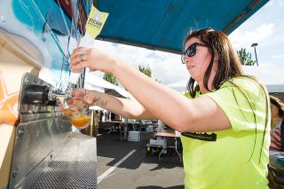 Marcus Larson/News-Register ##
Volunteer Tricia Harris pours a glass of Xicha Brewing’s Pale Especial for a customer during last year’s Brews & BBQs. Marcus Larson/News-Register ##
Volunteer Tricia Harris pours a glass of Xicha Brewing’s Pale Especial for a customer during last year’s Brews & BBQs.