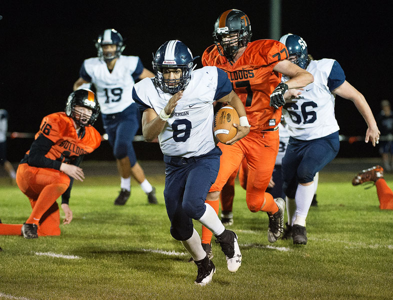 Marcus Larson/News-Register##
Sheridan s Josh Rogers sprints for the end zone on one of his three rushing touchdowns.