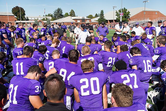 Marcus Larson/News-Register##
Linfield head coach Joseph Smith addresses his team after the 48-14 victory over Chapman University.