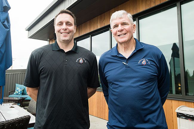 Marcus Larson/News-Register
John Buller and his son Ryan pose for a portrait outside on the building s new patio.