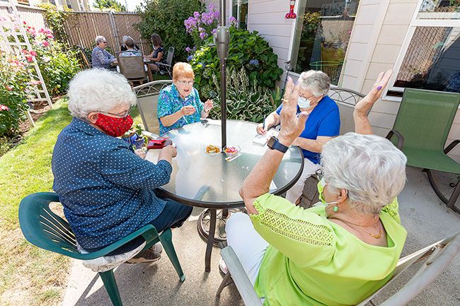 Marcus Larson News-Register ## Bunco players Claudia Wilson, Darlene Robins, Darlene LaDassor and Mona Clark react to Clark’s winning Bunco roll during their return
to the club’s monthly dice game.