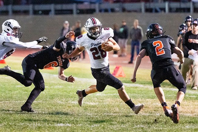 Marcus Larson/News-Register##
Dayton running back Nate Arce sprints through a gap to pick up a first down.