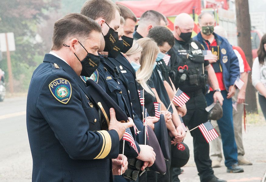 Marcus Larson/News-Register
##
Carlton police chief Kevin Martinez and other local first responders observe a moment of silence in remembrance of the victims of 9/11.