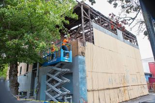 Kirby Neumann-Rea/News-Register##‘Barn-framed’ structure next to O.O. Hodson Building at Third and Cowls is being torn down to make way for housing