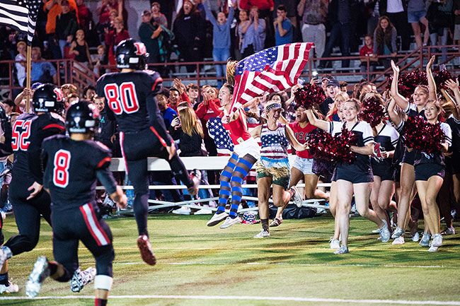 Marcus Larson/NewsRegister##
After the thrilling conclusion to McMinnville s 34-28 victory over North Salem, members of the team rush to celebrate with fellow students on the sidelines.