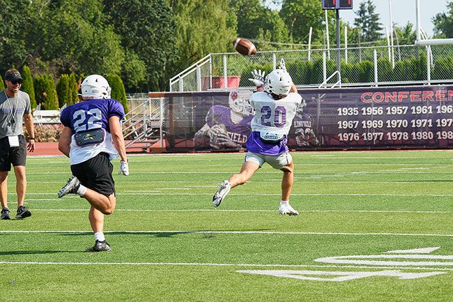 Rusty Rae/The News-Register##
Joel Valdez, the 2021 Northwest Conference Freshman of the Year, beats the Linfield secondary for a 50-yard gain during a practice scrimmage.