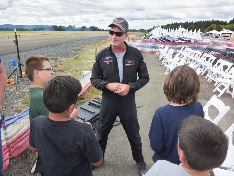 Starla Pointer / News-Register##Acrobatic pilot Jeff Boerboon  talks to McMinnville students, telling them his plane, the Yak 110, was created by combining the fuselages of two Yak 55s.