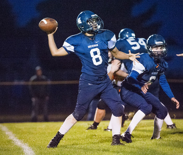 Marcus Larson/News-Register##
Sheridan quarterback Josh Rogers steps back to pass down field to an open receiver. Sheridan lost the game 61-16