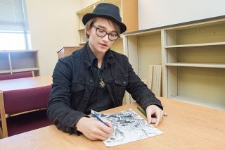 Marcus Larson/News-Register
McMinnville High art student Zach Reinker discusses his inspirations for a recent self portrait — modeled after a tree stump — he drew for a class assignment. Marcus Larson/News-Register
McMinnville High art student Zach Reinker discusses his inspirations for a recent self portrait — modeled after a tree stump — he drew for a class assignment.