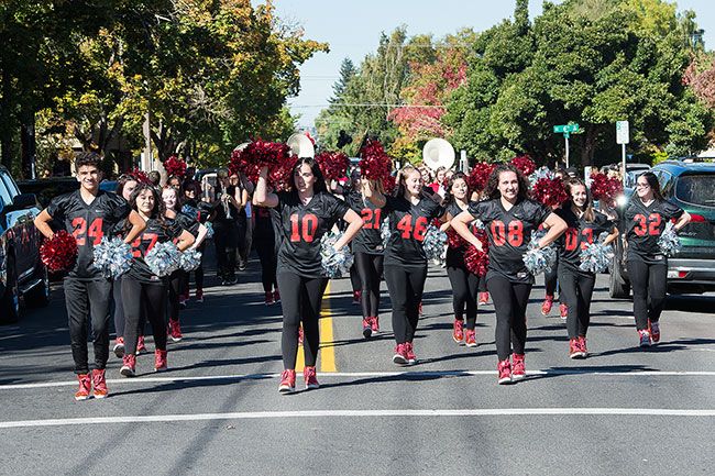 Marcus Larson / News-Register##Mac Mac High s dance team leads the parade as students march through downtown to show their school pride.