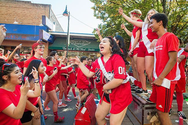 Marcus Larson / News-Register##McMinnville High School juniors cheer loudly as they celebrate class and school pride during the annual homecoming parade Thursday.