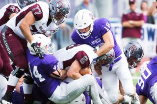 Marcus Larson/News-Register file photo##
Redlands’ Connor Kennedy (8) is swarmed by Linfield’s Duke Mackle (18) and Travis Swanson (44). Both Linfield players will prove critical to the Wildcats’ success against a dangerous Whitworth passing attack this weekend. Marcus Larson/News-Register file photo##
Redlands’ Connor Kennedy (8) is swarmed by Linfield’s Duke Mackle (18) and Travis Swanson (44). Both Linfield players will prove critical to the Wildcats’ success against a dangerous Whitworth passing attack this weekend.