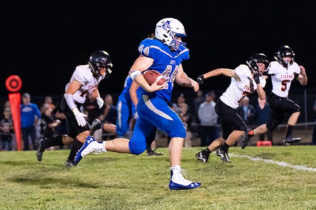 Marcus Larson/News-Register##
Amity fullback Wyett Yocum busts a long run during the Warriors  54-24 win over Yamhill-Carlton.