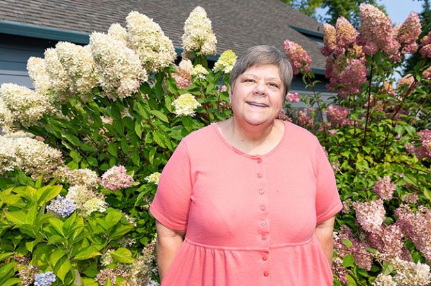 Marcus Larson/News-Register##Now that she is retired from her insurance agency, Chris Browne will have more time to spend with her hydrangeas and other flowers in her garden. She loves surrounding herself with friends, as well.