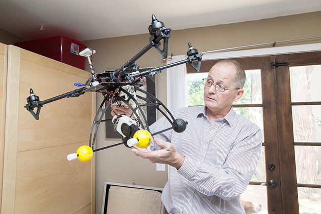 Marcus Larson/News-Register##Kleeman’s large drone can take hundreds of digital photos as it flies over a building or landscape.