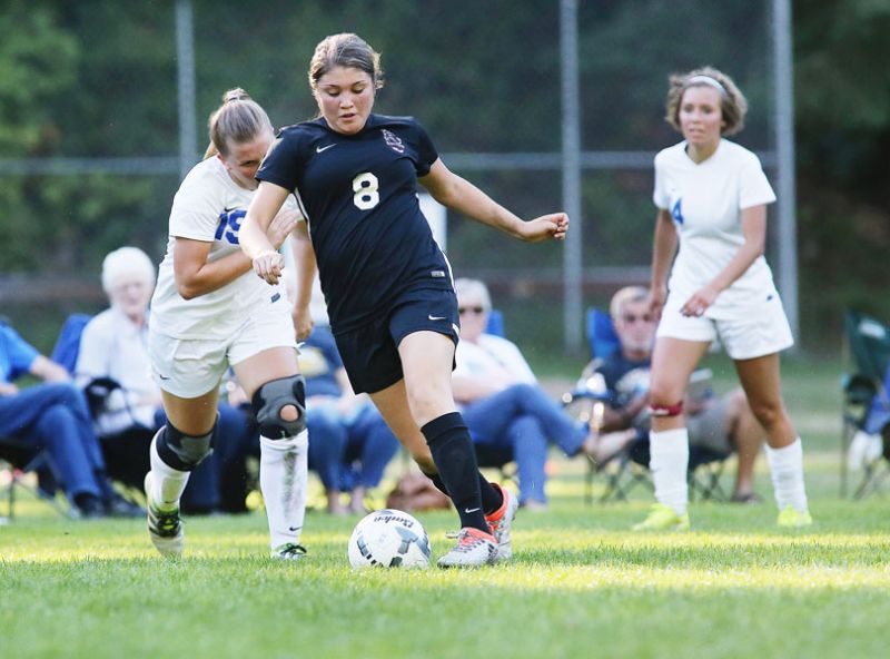 Rockne Roll/News-Register##
Dayton s Yasmin Arenas pushes the ball forward in Monday s match between the Pioneers and the Pirates at Western Mennonite School in Perrydale that was won by Dayton, 4-0.