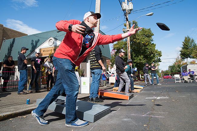 Marcus Larson / News-Register##Steve Wills of Team Funbags, left, competes in round two of the second annual Paint Mac Pink tournament.