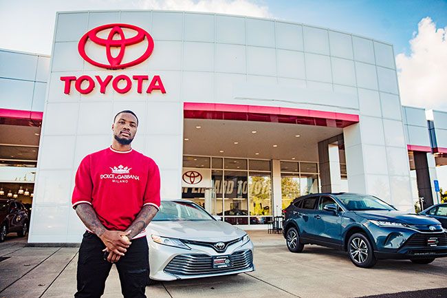 Photo courtesy Maddie Rubalcava##Damiam Lillard outside the Toyota dealership he now co-owns in McMinnville.