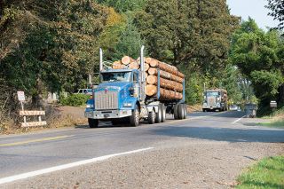 Marcus Larson/News-Register##Log trucks enter McMinnville from Westside Road, which becomes Baker Street near Tice Park. If Westside became a dedicated truck route, upwards of 1,000 trucks a day would flow through north McMinnville via the road. Marcus Larson/News-Register##Log trucks enter McMinnville from Westside Road, which becomes Baker Street near Tice Park. If Westside became a dedicated truck route, upwards of 1,000 trucks a day would flow through north McMinnville via the road.