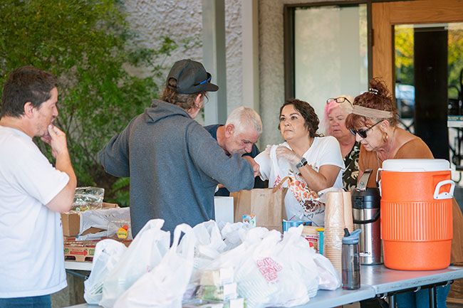 Kirby Neumann-Rea/News-Register
##A line of volunteers fills food, grocery and coffee orders for guests at Sunday Sandwiches
on Oct. 2. From left are Tom Earle, Valeria Orosco, Pat Carlson and Lee McClure, all of
McMinnville. Not pictured: Beth Frischmuth of McMinnville.
