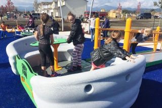 Steve Bagwell / News-Register##
Children play on a moveable boat at the new Kiwanis park in west McMinnville, where all rides and climbing equipment are handicapped accessible. Crowds attended the official opening of the park Saturday. Steve Bagwell / News-Register##
Children play on a moveable boat at the new Kiwanis park in west McMinnville, where all rides and climbing equipment are handicapped accessible. Crowds attended the official opening of the park Saturday.
