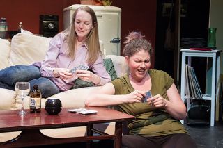 Marcus Larson/News-Register##Callie (Lesli Lucier) and Sara (Brittney Hancock) enjoy a night of playing cards and chatting about problems in their lives. Marcus Larson/News-Register##Callie (Lesli Lucier) and Sara (Brittney Hancock) enjoy a night of playing cards and chatting about problems in their lives.