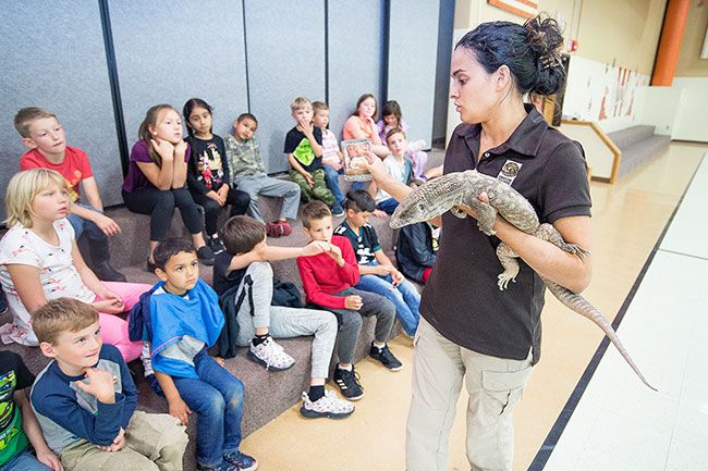 Marcus Larson/News-Register##
During a presentation at the Wascher School Kids on the Block program, Shanti Kriens introduces a monitor lizard from Africa. It s not something to fear, like its cousin, the huge komono dragon, she said.