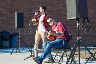 Rusty Rae/News-Register##
Logan Allen, foreground, and Nehemiah Creel, 2013 Willamina High School graduates,
entertained at the recent Bulldog Bash as the band Hill Drive