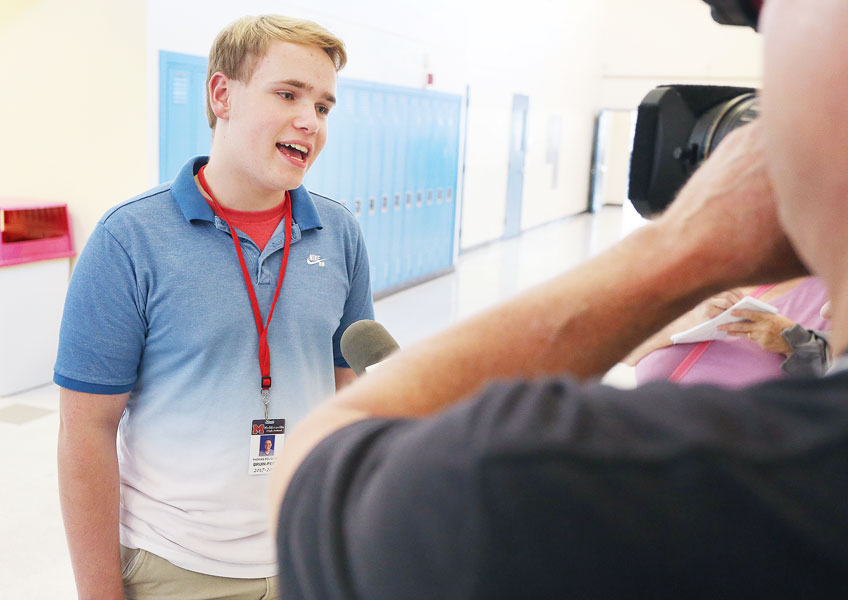 Rockne Roll/News-Register##
Tommy Douglass, managing editor of the Mac High Bruin newspaper, discusses the U.S. secretary of education s visit to his school. He asked the final question at her brief press conference.