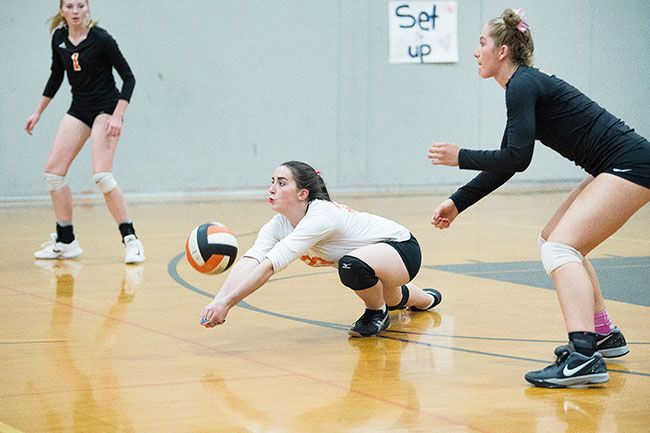 Marcus Larson/News-Register##
Y-C libero Rebecca Whitchurch dives to dig a Newport shot during the Tigers  3-0 win.