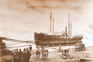 Image: Oregon Historical Society##In the spring of 1901, Allen & Roberts crews work to get the Columbia Lightship No. 50 off the beach and on its way through some nearby woods to the Columbia River. Image: Oregon Historical Society##In the spring of 1901, Allen & Roberts crews work to get the Columbia Lightship No. 50 off the beach and on its way through some nearby woods to the Columbia River.