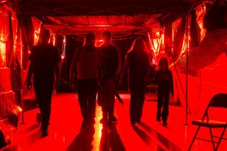 Rusty Rae/News-Register##James McAnelly, Joe Tribble, Joshua Park, Kathy Park and daughters Lexi and Saphira perform a walk-through of their initial installation of a haunted tunnel at the American Legion Hall in Carlton.
