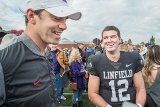 Marcus Larson/News-Register##
Linfield co-offensive coordinator and former quarterback Brett Elliott and Wyatt Smith discuss Smith’s record eight touchdown passes, which beat Elliott’s high mark set in 2004. Marcus Larson/News-Register##
Linfield co-offensive coordinator and former quarterback Brett Elliott and Wyatt Smith discuss Smith’s record eight touchdown passes, which beat Elliott’s high mark set in 2004.