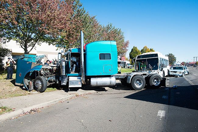 Marcus Larson / News-Register##A tractor-trailer rig, a small sedan and a YCTA bus collided about 12:30 p.m. Tuesday in northeast McMinnville.