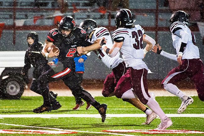 Marcus Larson/News-Register##
McMinnville running back Preston Ginter breaks free for a long gain during tonight s homecoming contest against Glencoe.