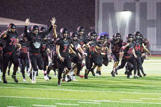 Marcus Larson/News-Register##
Grizzly football players rush toward the stands and their fans following the team’s 30-7 homecoming win over Glencoe. Marcus Larson/News-Register##
Grizzly football players rush toward the stands and their fans following the team’s 30-7 homecoming win over Glencoe.