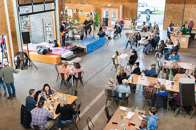 Marcus Larson/News-Register##Guitarist Jake Blair leads a set at the Mac Market on Saturday. The Market is expanding its food, beverage and event offerings, with another music series coming up early next year.