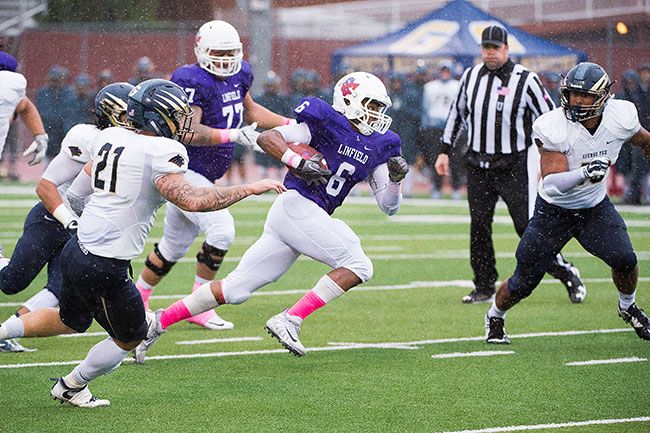 Marcus Larson/News-Register##
Chidubem Nnoli was leading the rusher on the day with 120 yards on 27 carries in the  Cats 12-6 win over George Fox.