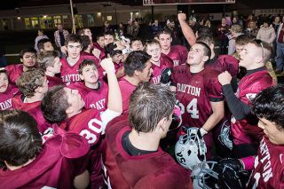 Marcus Larson/News-Register##The Dayton Pirates celebrate their 35-28 victory over the Taft Tigers Friday evening at Gubser Field.
