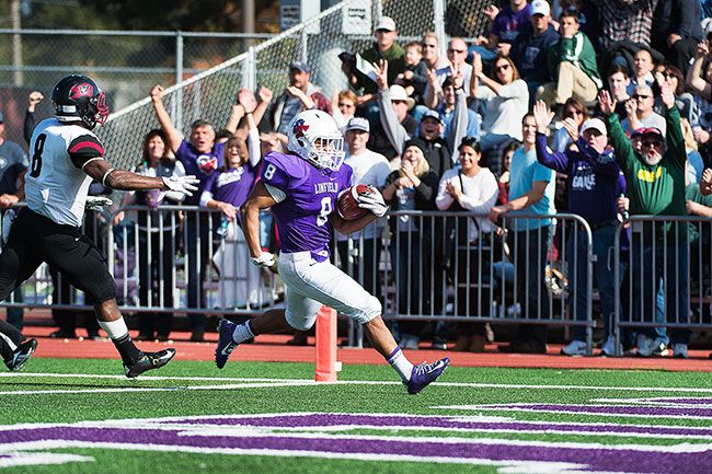 Marcus Larson/News-Register##Linfield running back Spencer Payne crosses the goal line on a 52-yard receiving touchdown in the second quarter of the Wildcats  52-10 victory over Whitworth Saturday afternoon.