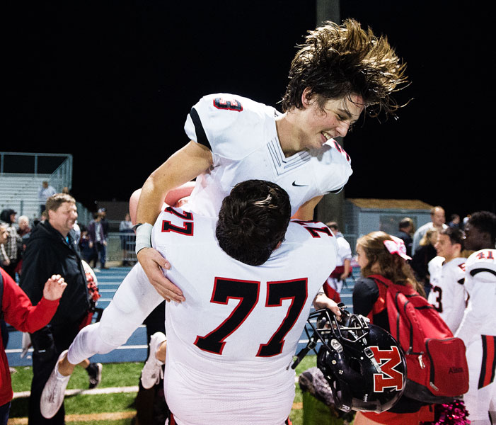Marcus Larson/News-Register##
McMinnville s Colton Smith is lifted into the air by Grizzly lineman John Kropf after Smith scored the winning TD on an 83-yard kickoff return with 17-seconds left in the game.