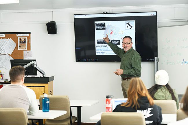 Rusty Rae / News-Register##
Greg Jones, head of the Linfield Wine Studies program, teaches a class
Wednesday. Wine studies is one of several new majors at the college,
which is adding programs with an eye toward graduate studies, as well.